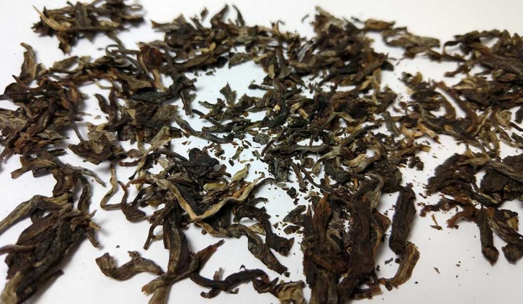 Photo of raw pu-erh leaves